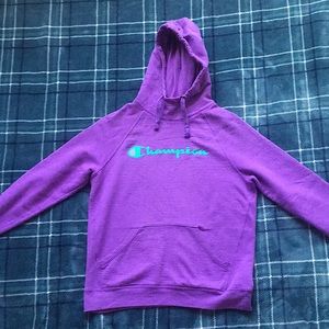 Purple and green women’s champion hoodie.